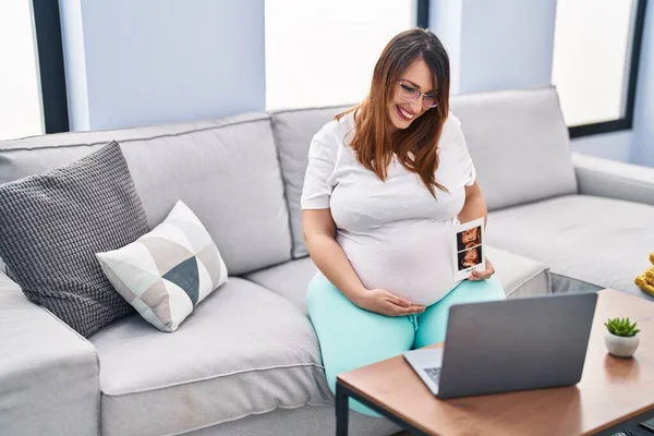 Young Pregnant Woman Having Video Call Holding Baby Ecography Home — Stock fotografie