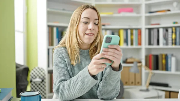 Young Blonde Woman Student Using Smartphone Library University — Foto de Stock