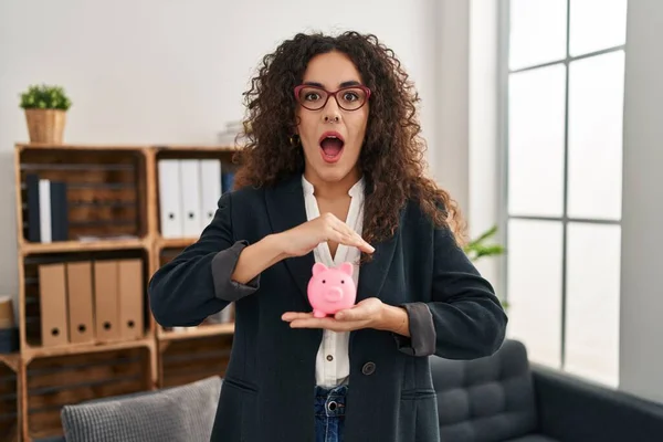 Young Hispanic Woman Holding Piggy Bank Afraid Shocked Surprise Amazed — Stock Photo, Image