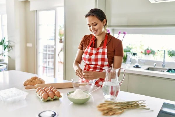 Young Beautiful Hispanic Woman Smiling Confident Mixing Bread Dough Bowl — Φωτογραφία Αρχείου