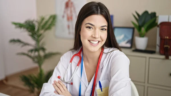 Young Beautiful Hispanic Woman Doctor Smiling Confident Sitting Table Clinic — Stock Photo, Image