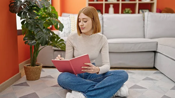 Young Blonde Woman Writing Notebook Sitting Floor Home — Stock Fotó