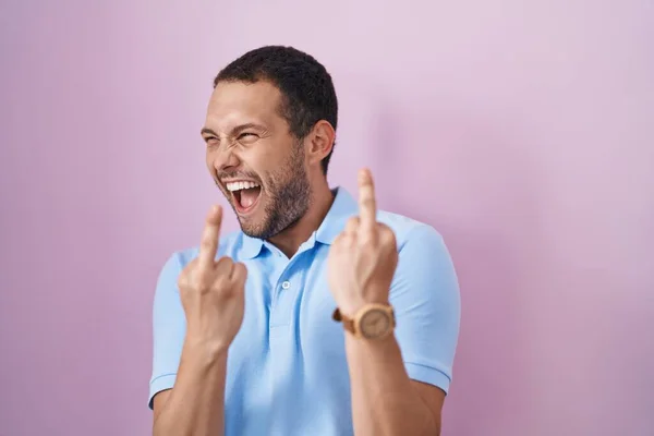 Hispanic Man Standing Pink Background Showing Middle Finger Doing Fuck —  Fotos de Stock