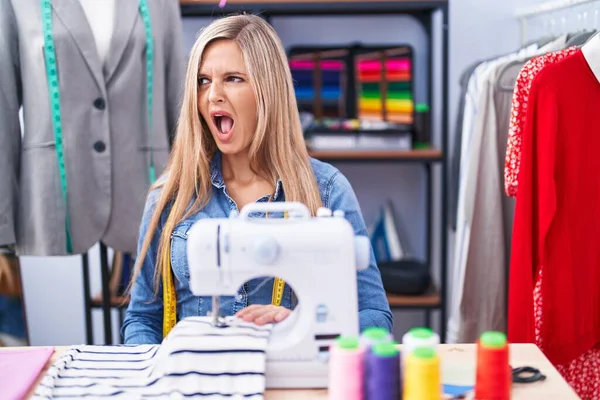 Blonde Woman Dressmaker Designer Using Sew Machine Angry Mad Screaming — Foto de Stock