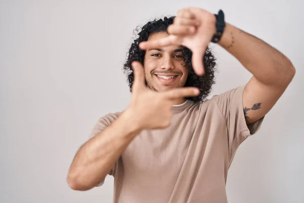 Hispanic Man Curly Hair Standing White Background Smiling Making Frame — Stock Photo, Image