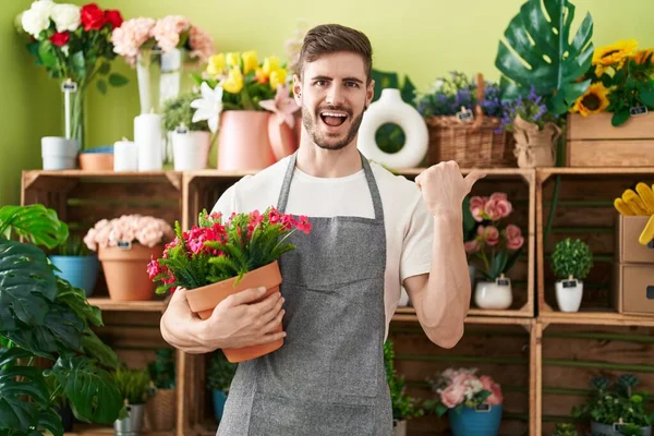 Hispanic Man Beard Working Florist Shop Holding Plant Pointing Thumb — Stock Photo, Image