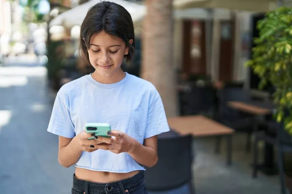 Adorable Hispanic Girl Smiling Confident Using Smartphone Street — ストック写真