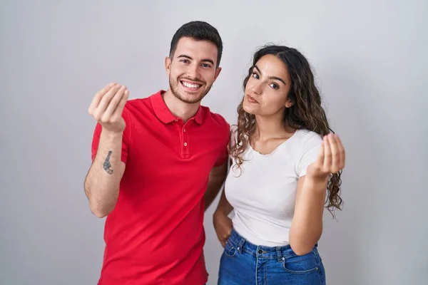 Young Hispanic Couple Standing Isolated Background Doing Italian Gesture Hand — Stock Photo, Image