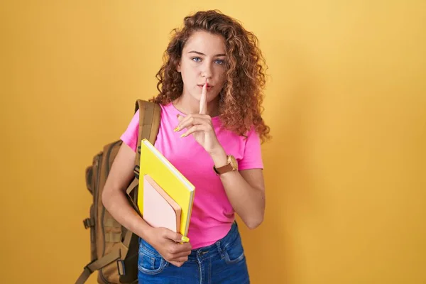 Young Caucasian Woman Wearing Student Backpack Holding Books Asking Quiet — Stok fotoğraf