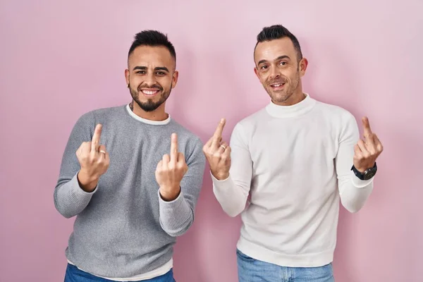 Homosexual Couple Standing Pink Background Showing Middle Finger Doing Fuck — Stock Fotó