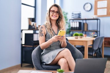 Young woman business worker using smartphone at office