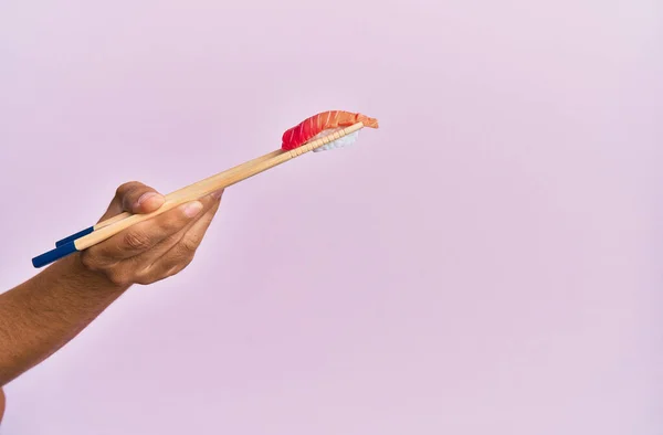 Hand Man Holding Tuna Nigiri Chopsticks Isolated Pink Background — Stok fotoğraf