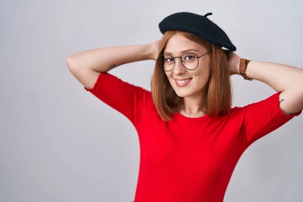 Young Redhead Woman Standing Wearing Glasses Beret Relaxing Stretching Arms — Stock Photo, Image