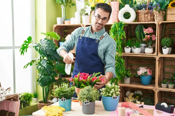 Young Hispanic Man Florist Using Diffuser Watering Plant Flower Shop — Stockfoto