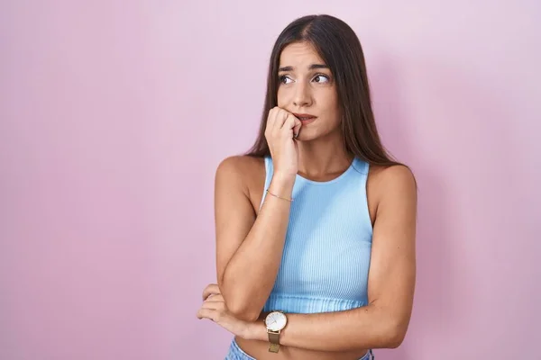 Young Brunette Woman Standing Pink Background Looking Stressed Nervous Hands — Stock fotografie