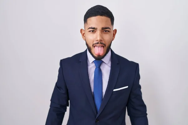 Young Hispanic Man Wearing Business Suit Tie Sticking Tongue Out — Stock Photo, Image