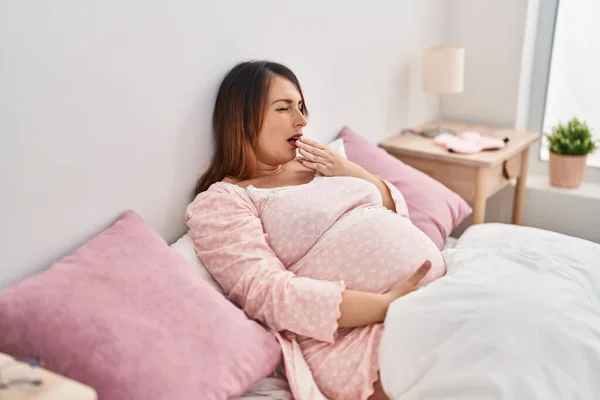 Young Pregnant Woman Yawning Sitting Bed Bedroom — Stock fotografie