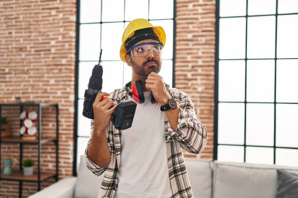 Young Hispanic Man Beard Working Home Renovation Serious Face Thinking — Stock Photo, Image