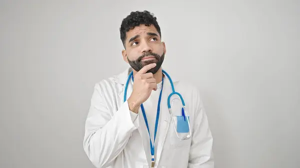 Young Hispanic Man Doctor Standing Doubt Expression Thinking Isolated White — Stock Photo, Image