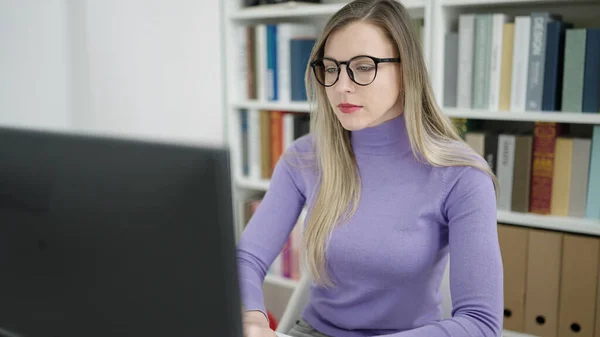 Young Blonde Woman Student Using Computer Studying Library University —  Fotos de Stock