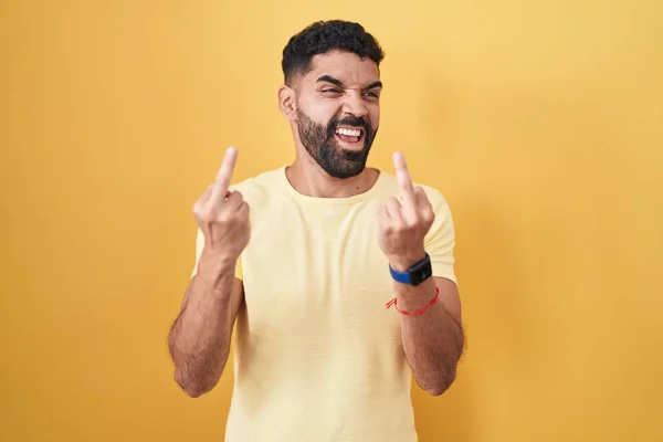 Hispanic Man Beard Standing Yellow Background Showing Middle Finger Doing — Stockfoto