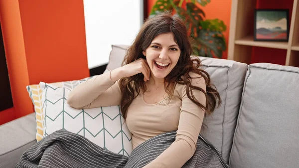 stock image Young beautiful hispanic woman smiling confident sitting on sofa at home