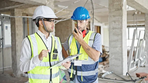 Two Men Builders Talking Walkie Talkie Reading Document Construction Site — Stock Photo, Image