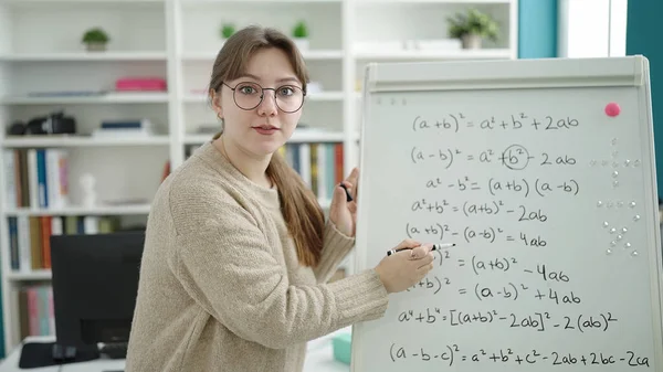 Young Blonde Woman Teacher Explaining Maths Lesson Library University - Stock-foto