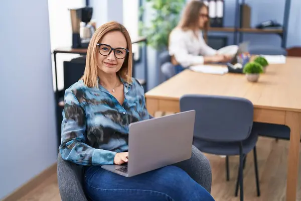 Two Women Business Workers Using Laptop Speaking Office — Stok fotoğraf