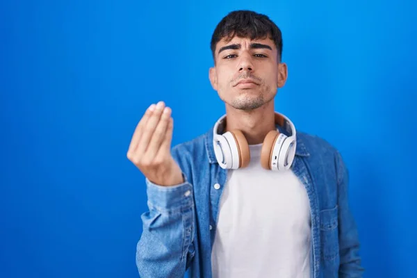 Young Hispanic Man Standing Blue Background Doing Italian Gesture Hand — Stockfoto
