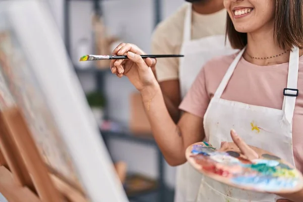 stock image Man and woman couple smiling confident drawing at art studio