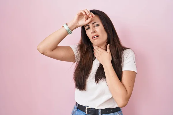 Young Brunette Woman Standing Pink Background Touching Forehead Illness Fever — Stock Photo, Image