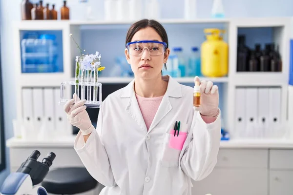 Young Brunette Woman Working Scientist Laboratory Relaxed Serious Expression Face — Stock Photo, Image