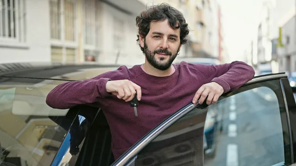 Young Hispanic Man Smiling Confident Holding Key New Car Street — стоковое фото