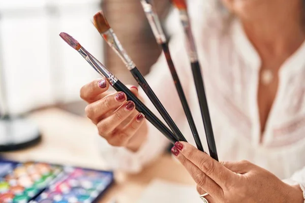 Middle Age Woman Artist Holding Paintbrushes Art Studio — Stockfoto