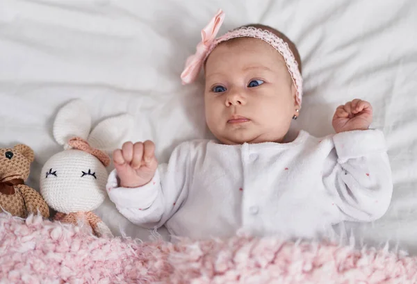 Adorable Caucasian Baby Lying Bed Dolls Bedroom — Stock fotografie