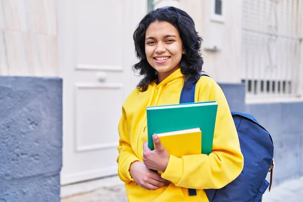 Young Latin Woman Student Smiling Confident Holding Books Street — ストック写真