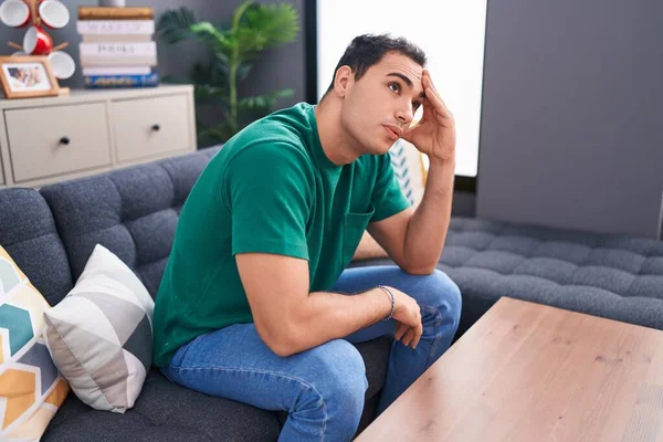Young Hispanic Man Stressed Sitting Sofa Home — Stockfoto