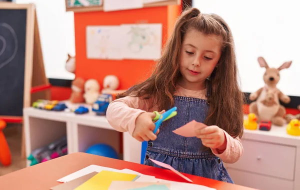 Adorable Hispanic Girl Student Smiling Confident Cutting Paper Kindergarten — Stockfoto