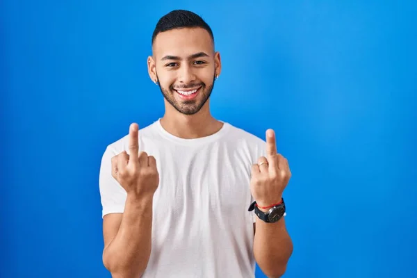 Young Hispanic Man Standing Blue Background Showing Middle Finger Doing — Φωτογραφία Αρχείου
