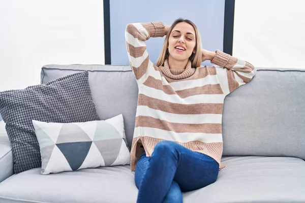 Young Woman Relaxed Hands Head Sitting Sofa Home — Foto Stock