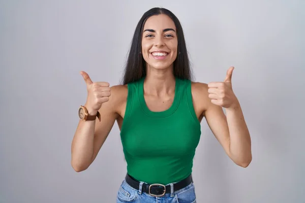 Young Woman Standing Isolated Background Success Sign Doing Positive Gesture — Foto Stock