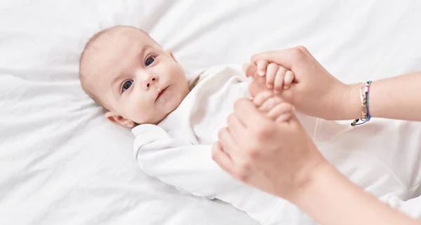 Adorable Caucasian Baby Lying Bed Holding Mother Hands Bedroom — Stock Photo, Image