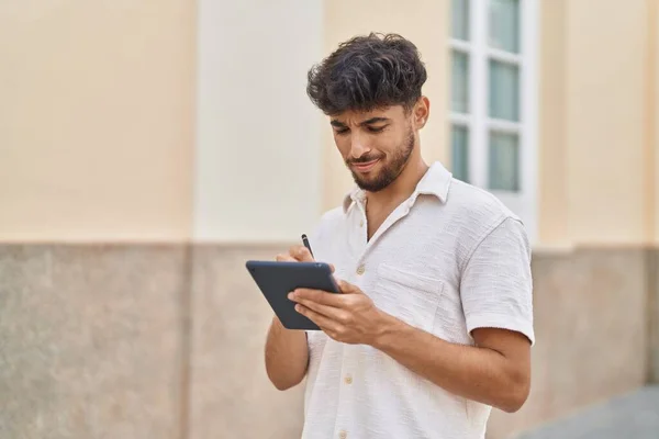 Young Arab Man Drawing Touchpad Standing Street — Stockfoto