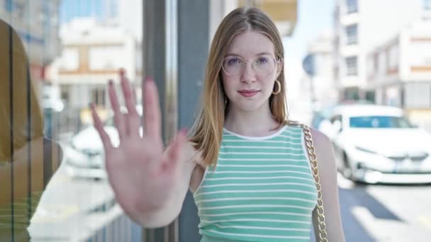 Young Blonde Woman Doing Stop Gesture Hand Street — Vídeo de Stock