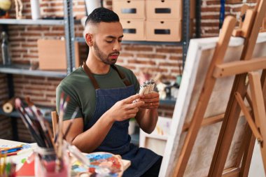 African american man artist drawing at art studio