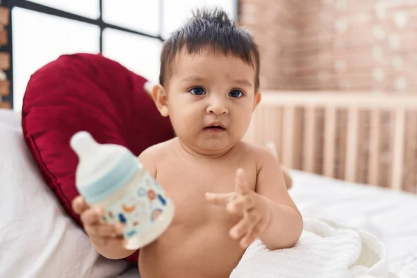 Adorable Hispanic Boy Holding Feeding Bottle Sitting Bed Bedroom — Stock Photo, Image