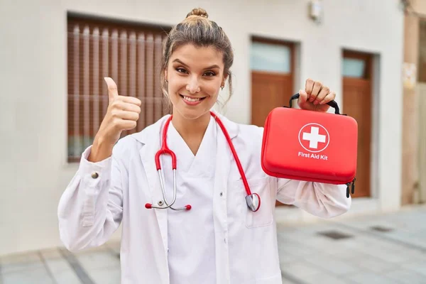 Young Doctor Woman Holding First Aid Kit Smiling Happy Positive — Stock fotografie