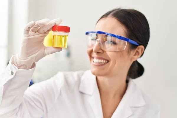Young Beautiful Hispanic Woman Scientist Holding Urine Test Tube Laboratory — Stock Photo, Image