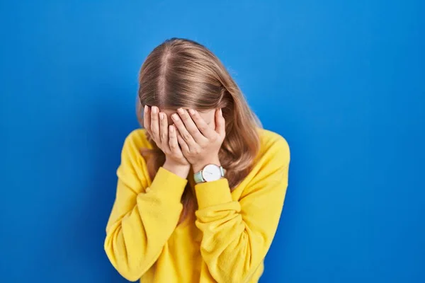 Young Caucasian Woman Standing Blue Background Sad Expression Covering Face — Stock fotografie